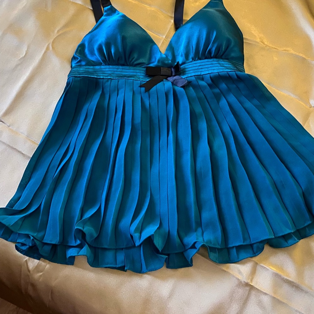 beautiful green baby doll in satin